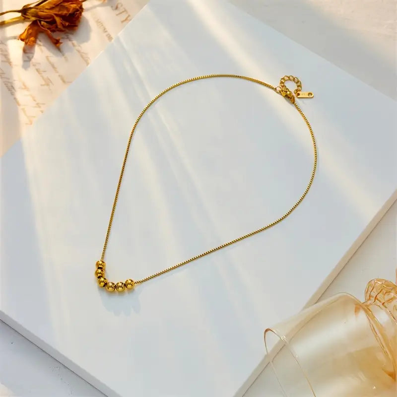 Elegant Golden Bead Pendant Necklace