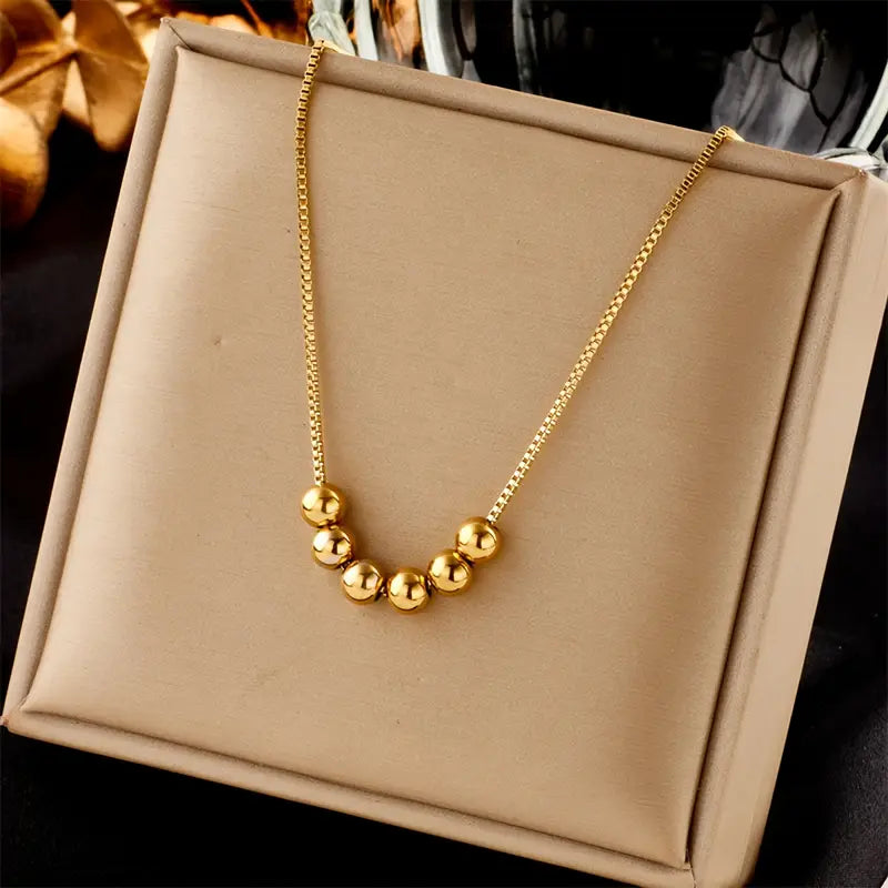 Elegant Golden Bead Pendant Necklace